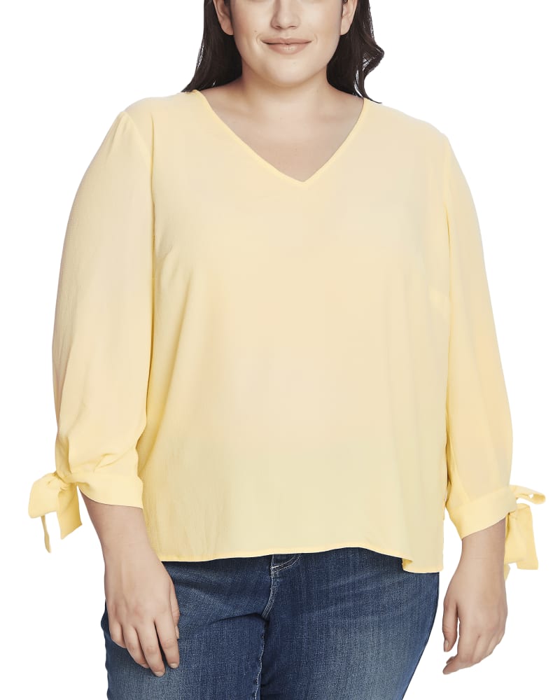 Front of a model wearing a size 1X Alana Tie-Sleeve Blouse in LEMONADE by CeCe. | dia_product_style_image_id:263327
